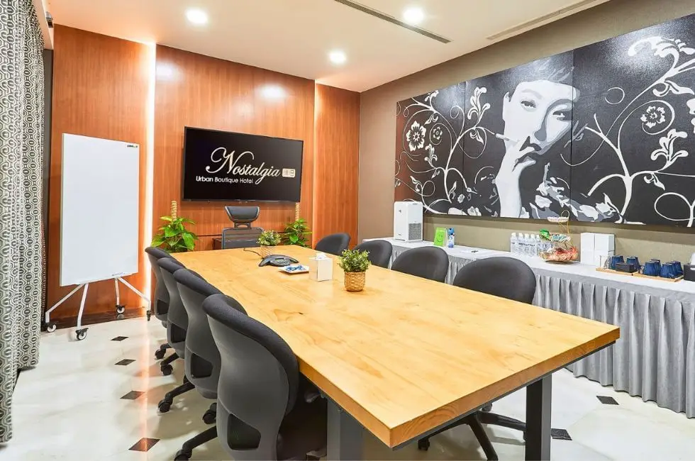 A well-appointed meeting room facility with boardroom seating arrangement.